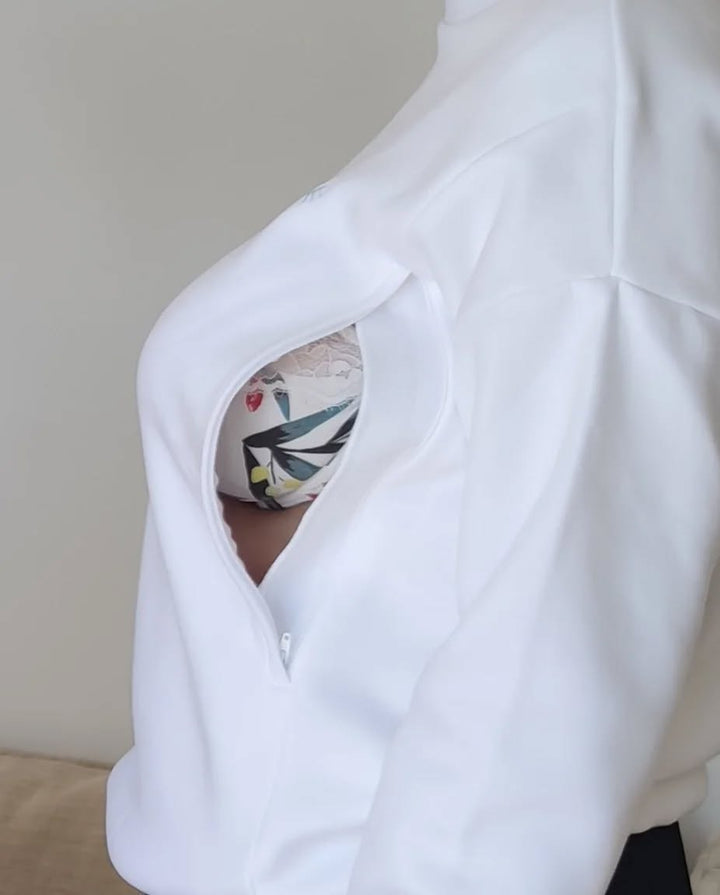 Détail du zip latéral ouvert du sweat blanc Sweet Milk et de sa doublure imprimée